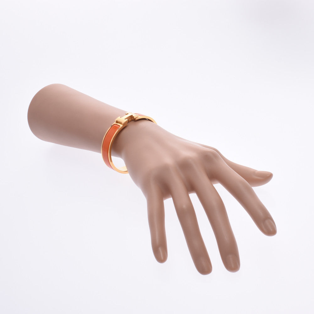 Hermes click crack PM bangle orange gold metal fittings unisex