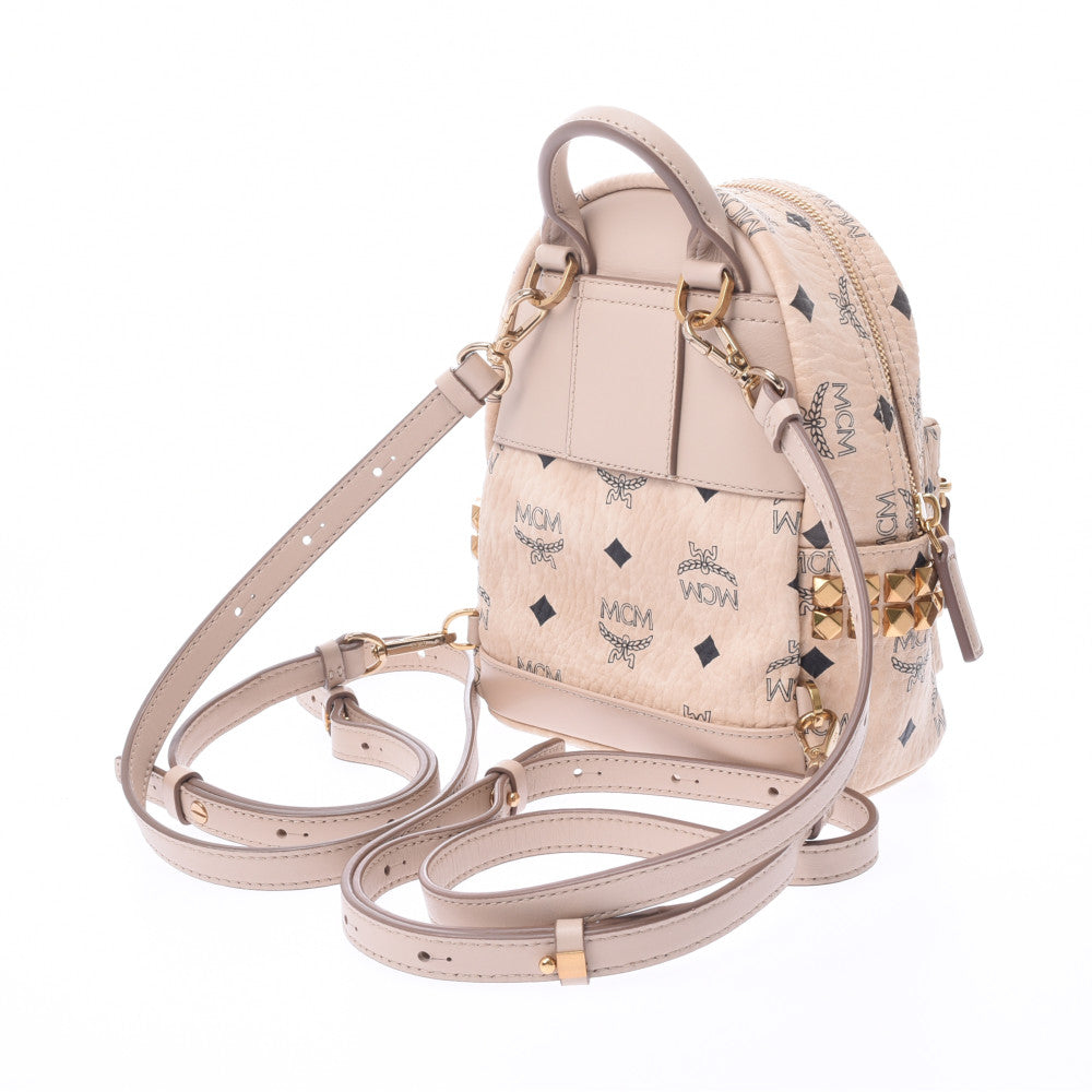 MCM レザーキャディバッグ ベージュ エムシーエムバックパックミニ サイドスタッズ ベージュ/ゴールド